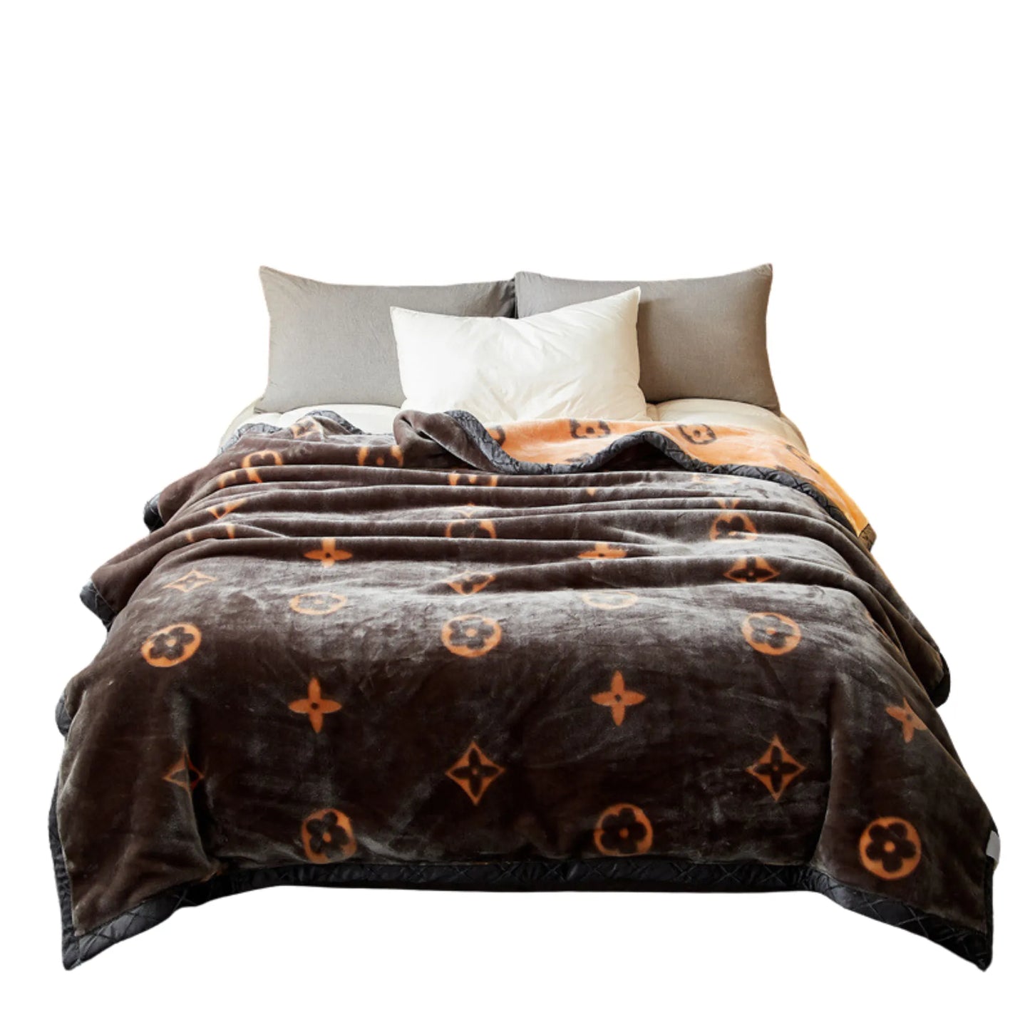 SilkenWarmth Raschel blanket, orange motif, styled on a double bed