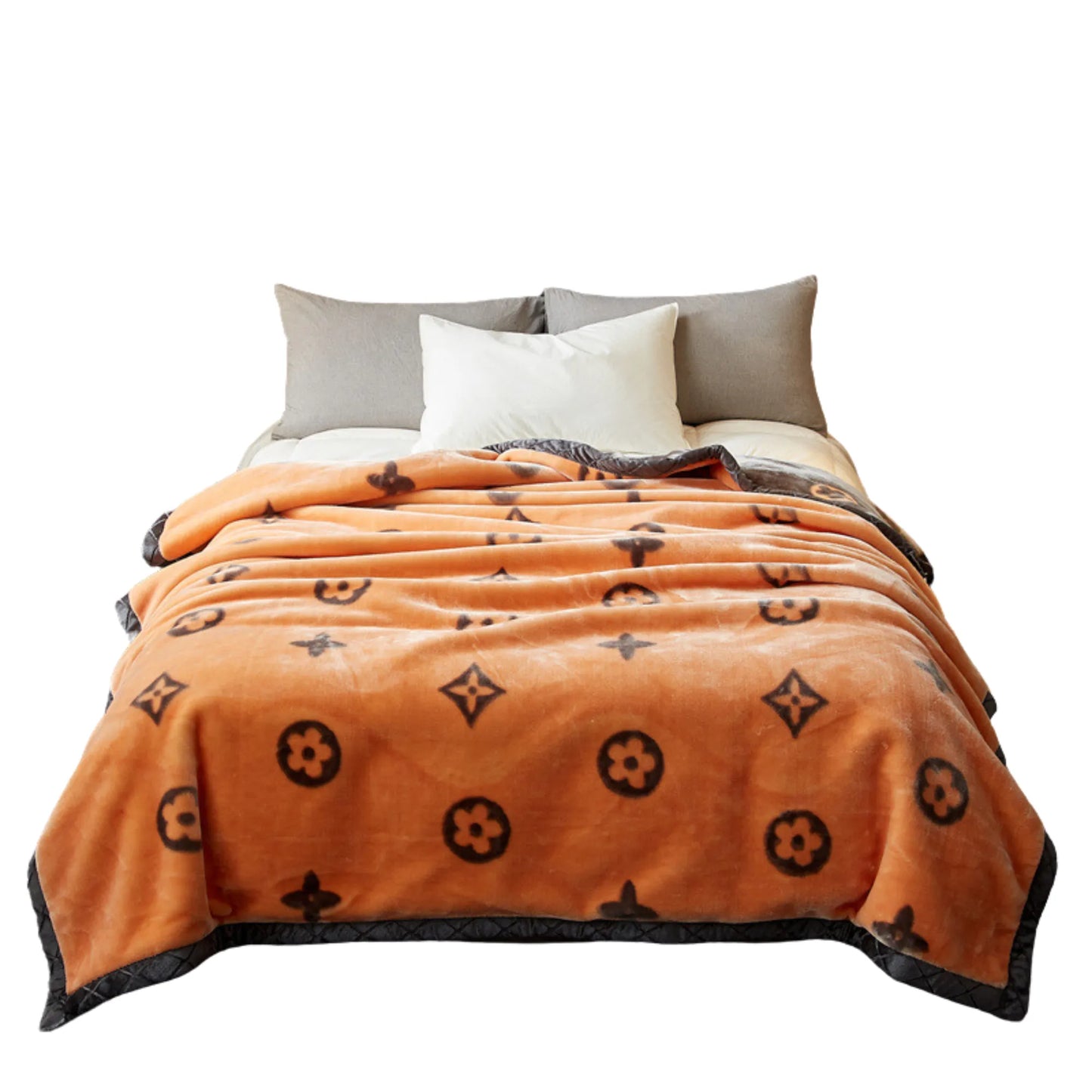 SilkenWarmth Raschel blanket, orange motif, bed styling close-up